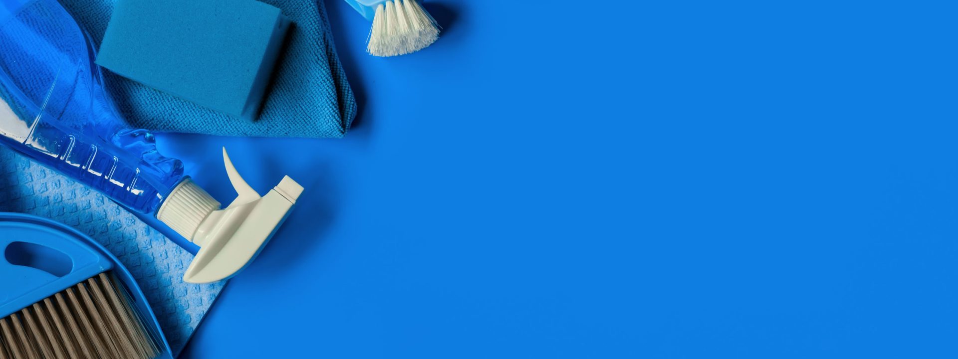 Blue cleaning kit for housekeeping. Top view. Copy space.